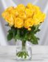 Arreglo floral Elisabetta con 18 rosas amarillas frescas en un jarrón de cristal, ideal para expresar amistad y gratitud.