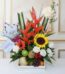 Arreglo floral con frutas tamarillo, girasoles, rosas blancas, heliconias y globo 'Feliz Día' en base de madera, ideal para e