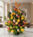 Arreglo floral vibrante con rosas amarillas y salmón, girasol, ave del paraíso y frutas tropicales como uvas, manzana y lima,