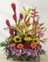 Arreglo floral GINGER exótico con orquídea hawaiana, heliconias, jengibre rojo, girasoles y gerberas en tonos vibrantes sobre
