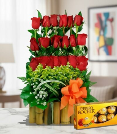 Arreglo floral Musca con rosas rojas vibrantes y chocolates Ferrero Rocher, ideal para regalar en ocasiones especiales.