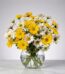 Arreglo floral Agatha con margaritas amarillas y blancas en un jarrón de cristal, ideal para regalar y decorar.